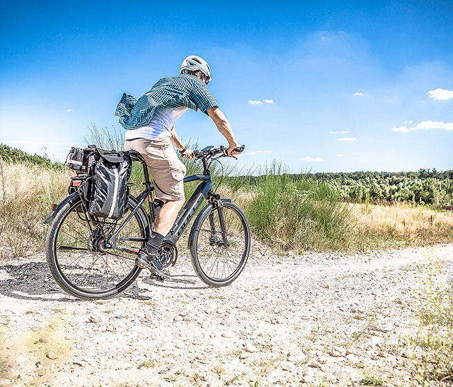 Bicyclist riding on bike trail