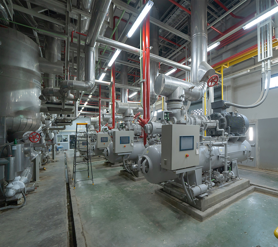 large industrial facility water chillers in a factory setting