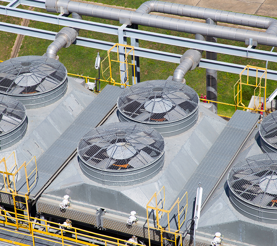 Aerial view of air-cooled heat exchanger units at an industrial plant.